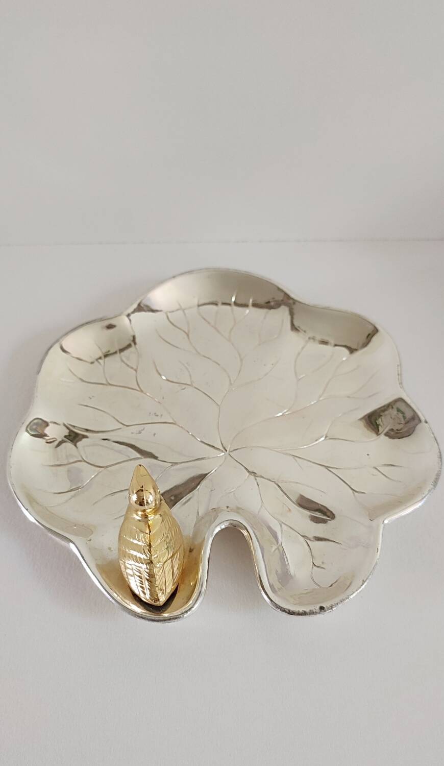 A Lancel pocket tray in silver metal.