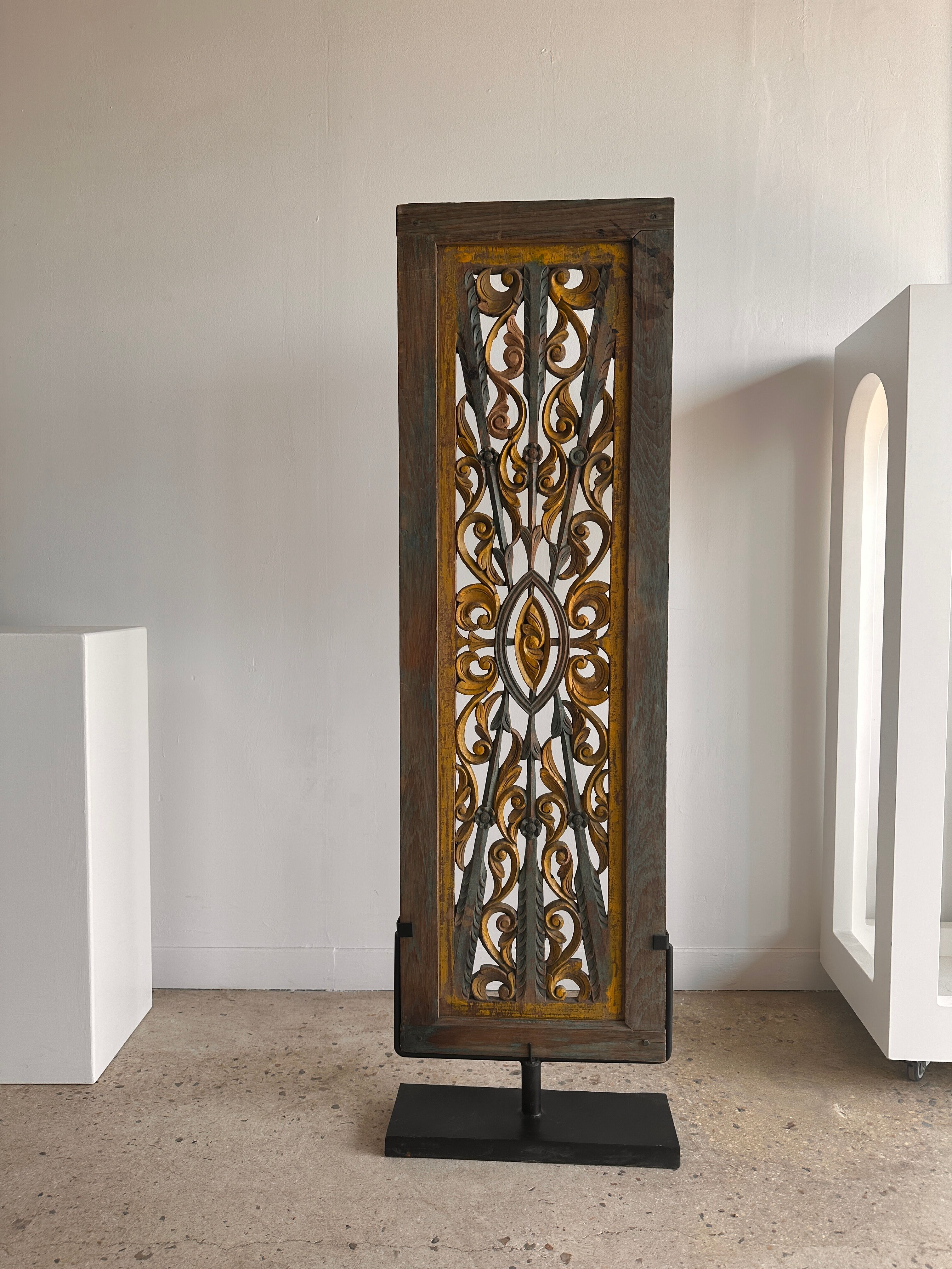 Rectangular Indonesian construction element with blue and yellow plant in carved wood