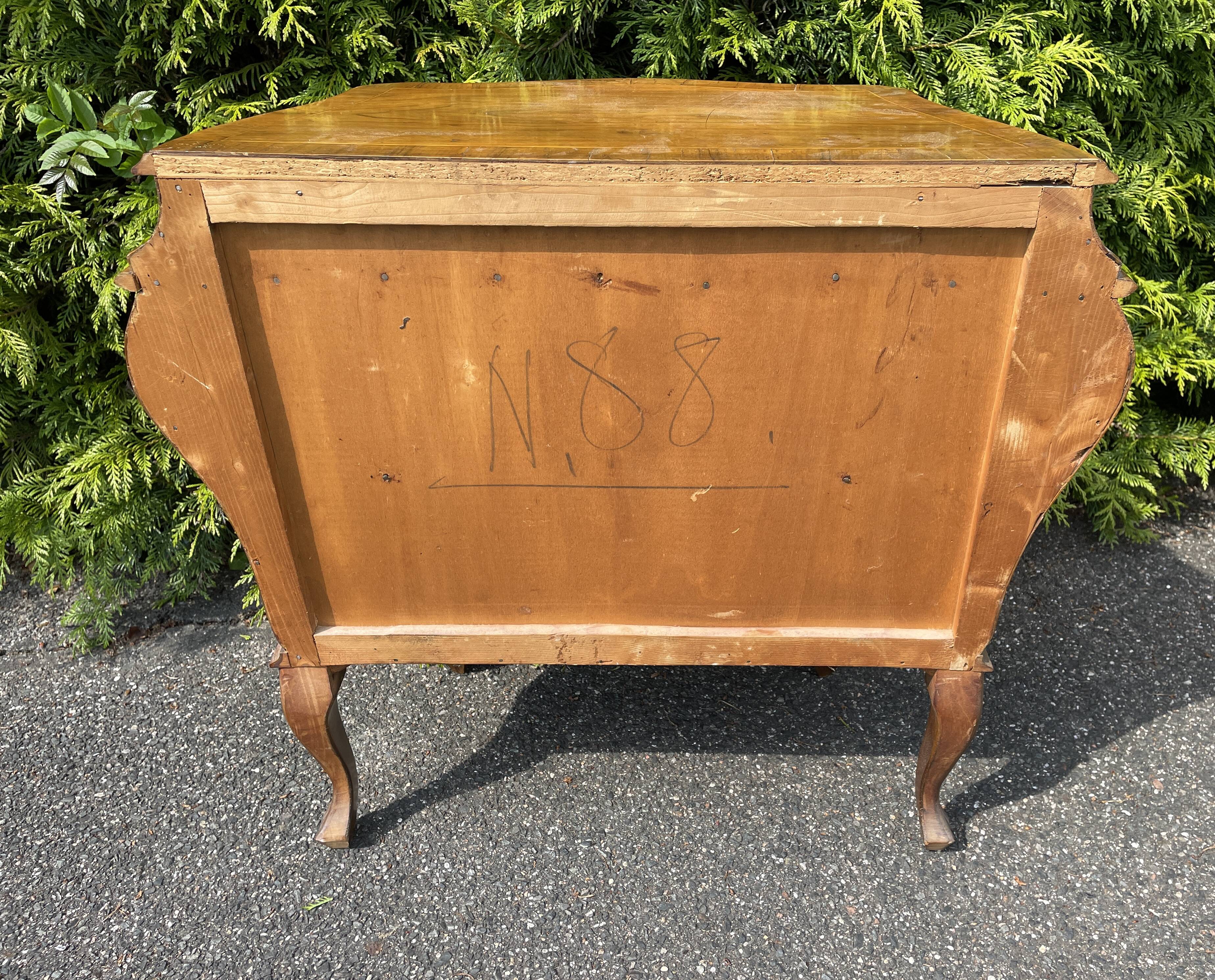 Chest of drawers in Dutch style marquetry with secret drawer.