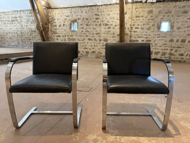 Pair of Executive Chairs by Knoll attributed to Charles Pollock in black leather.