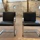 Pair of Executive Chairs by Knoll attributed to Charles Pollock in black leather.