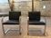 Pair of Executive Chairs by Knoll attributed to Charles Pollock in black leather.