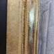 19th-century gilded trumeau mirror with restaurant slate.