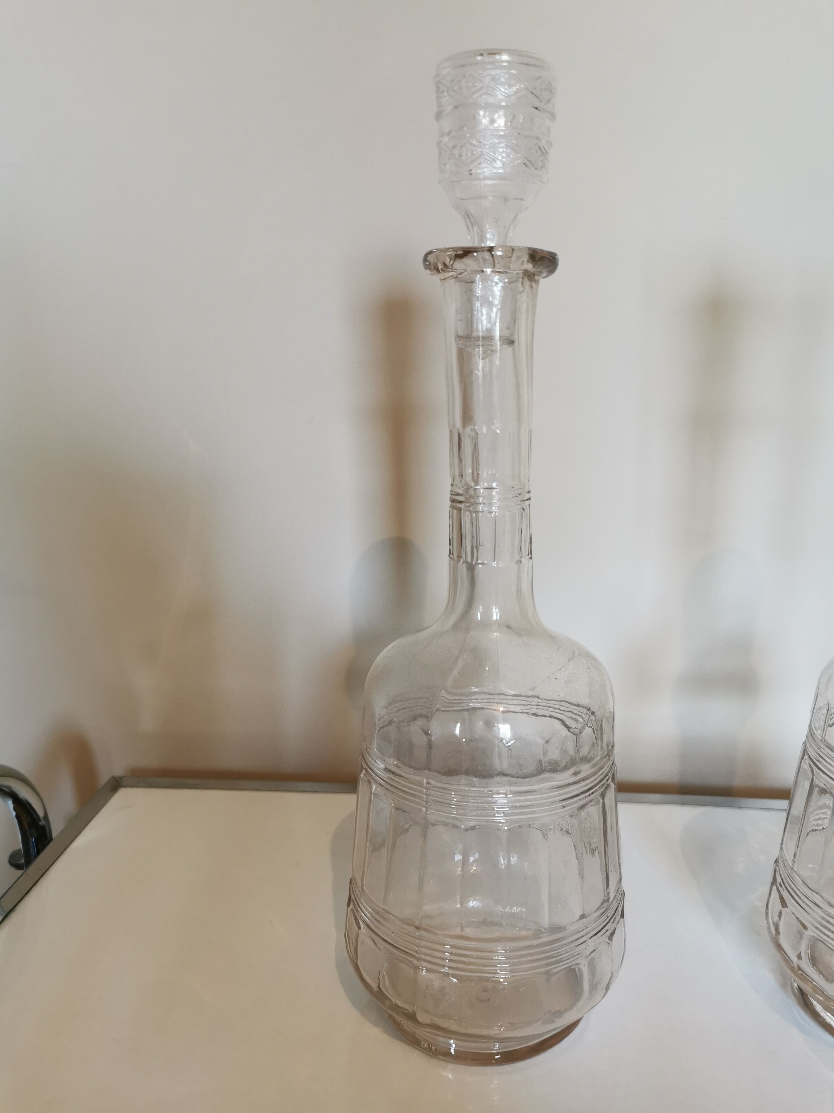 Pair of antique moulded glass decanters