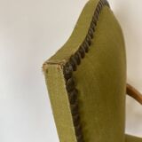 Olive green upholstered armchairs with studs