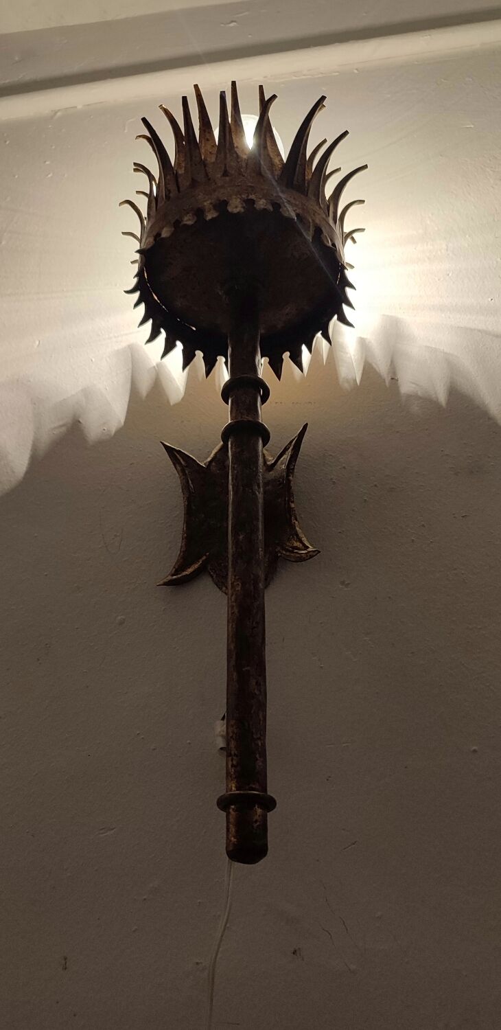 Wrought iron and gold leaf wall light. Spain, 1950s.