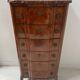 Transitional style chest of drawers in rosewood and amaranth veneer, 20th century.