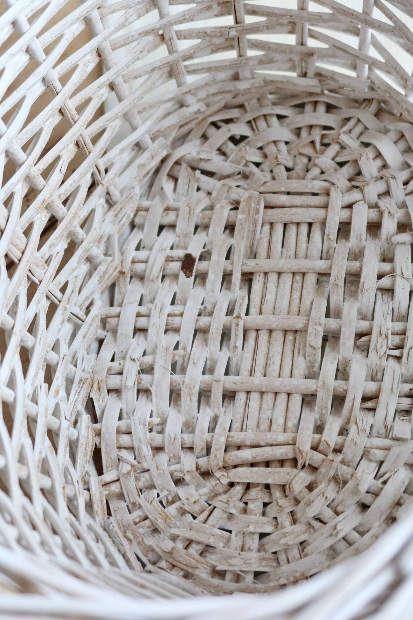 Vintage wicker basket painted white