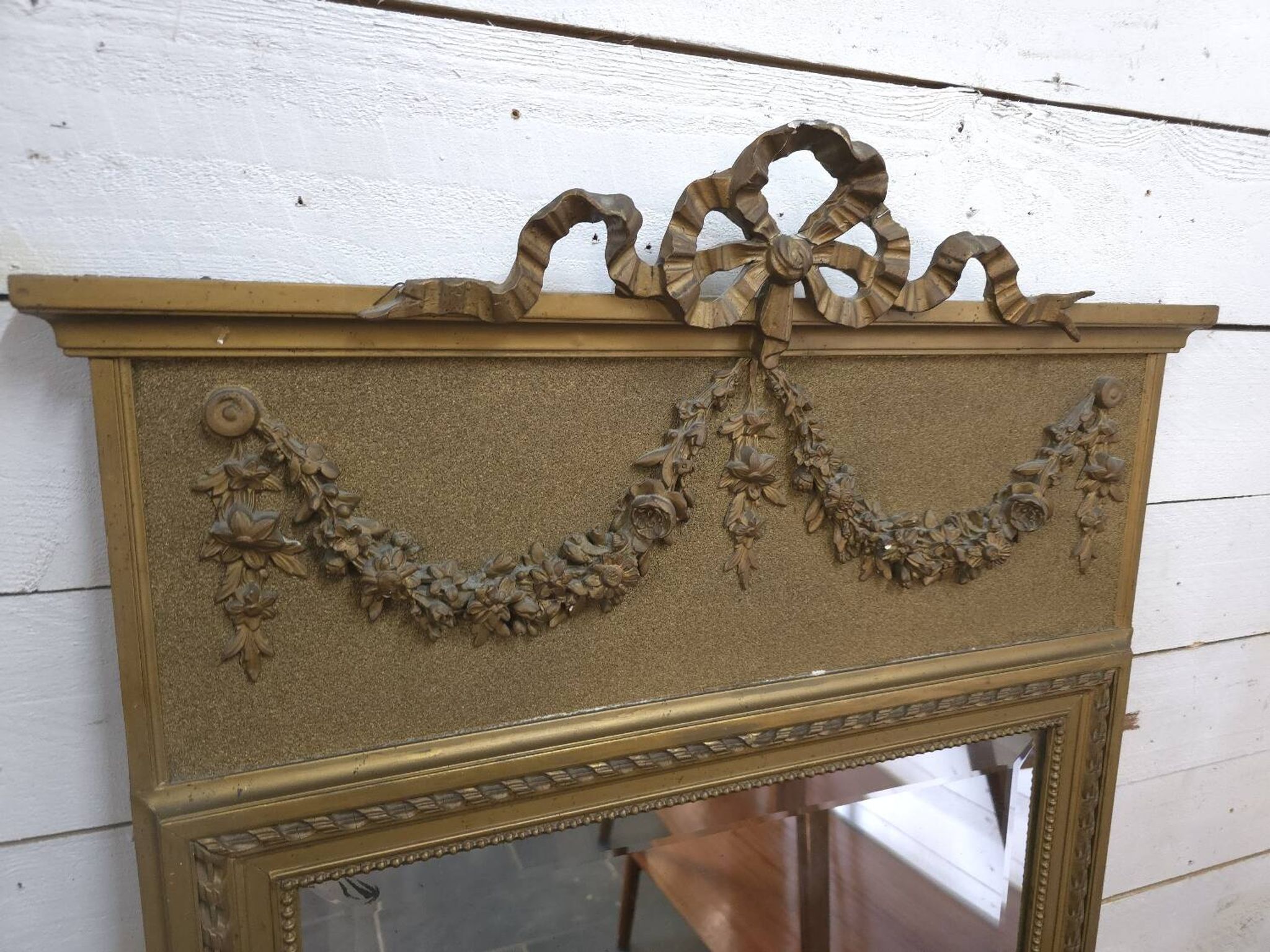 Gilded patinated trumeau mirror