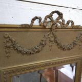 Gilded patinated trumeau mirror