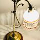 Old lamp adjustable on foot tulip golden brass.
