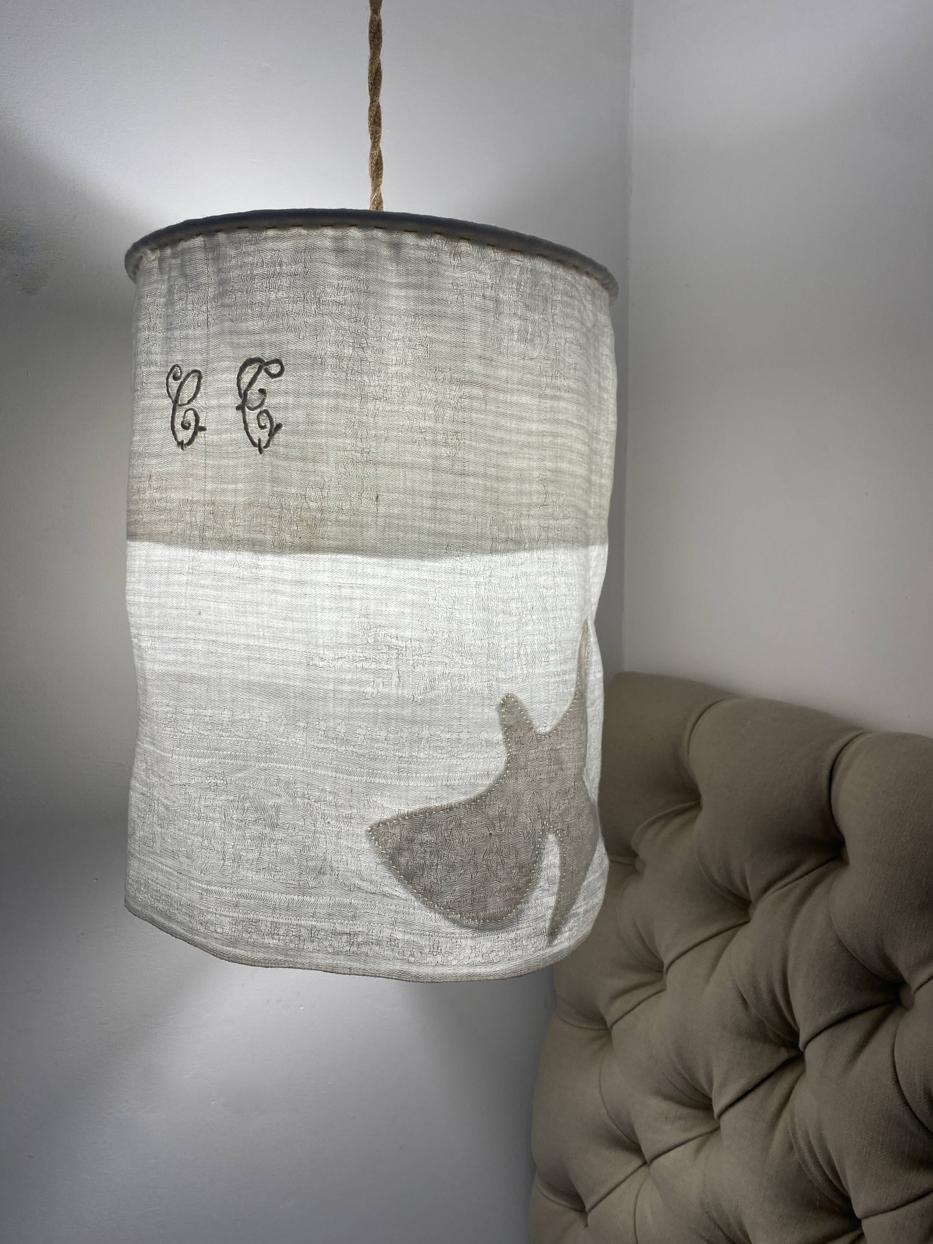 Old linen drapery with monogram and bird by Georges Braque