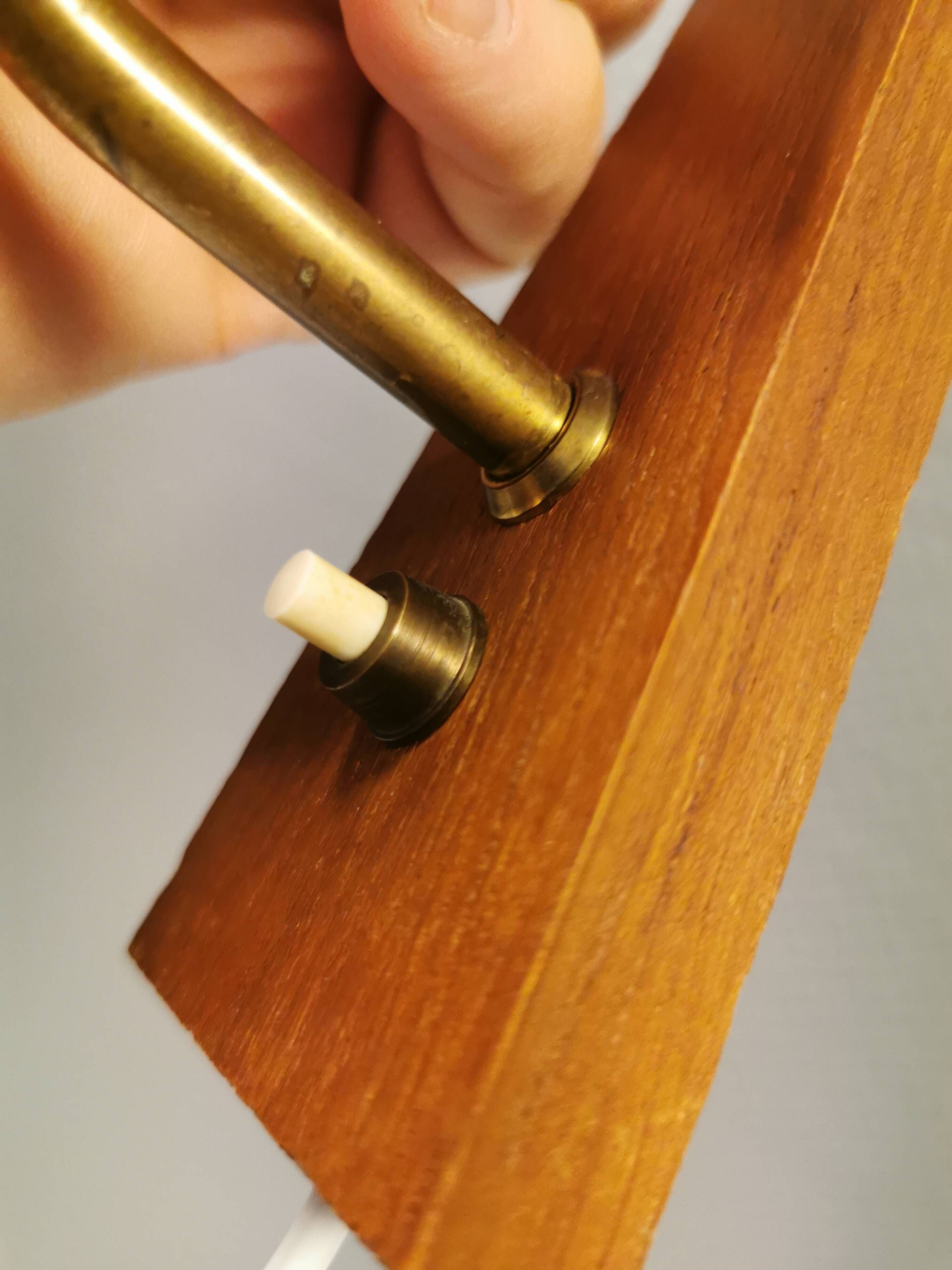 A set of Danish wall lights in champagne coloured glass with brass and teak.
