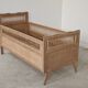 Children's bed in wood and sandblasted rattan from the 1960s.
