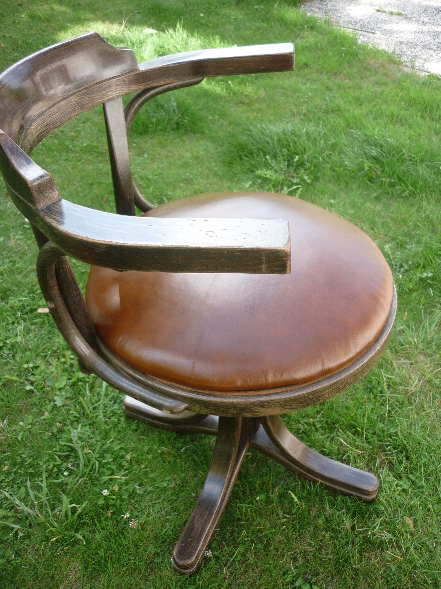 Swivel leather armchair