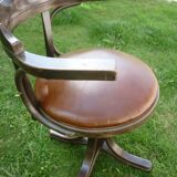 Swivel leather armchair