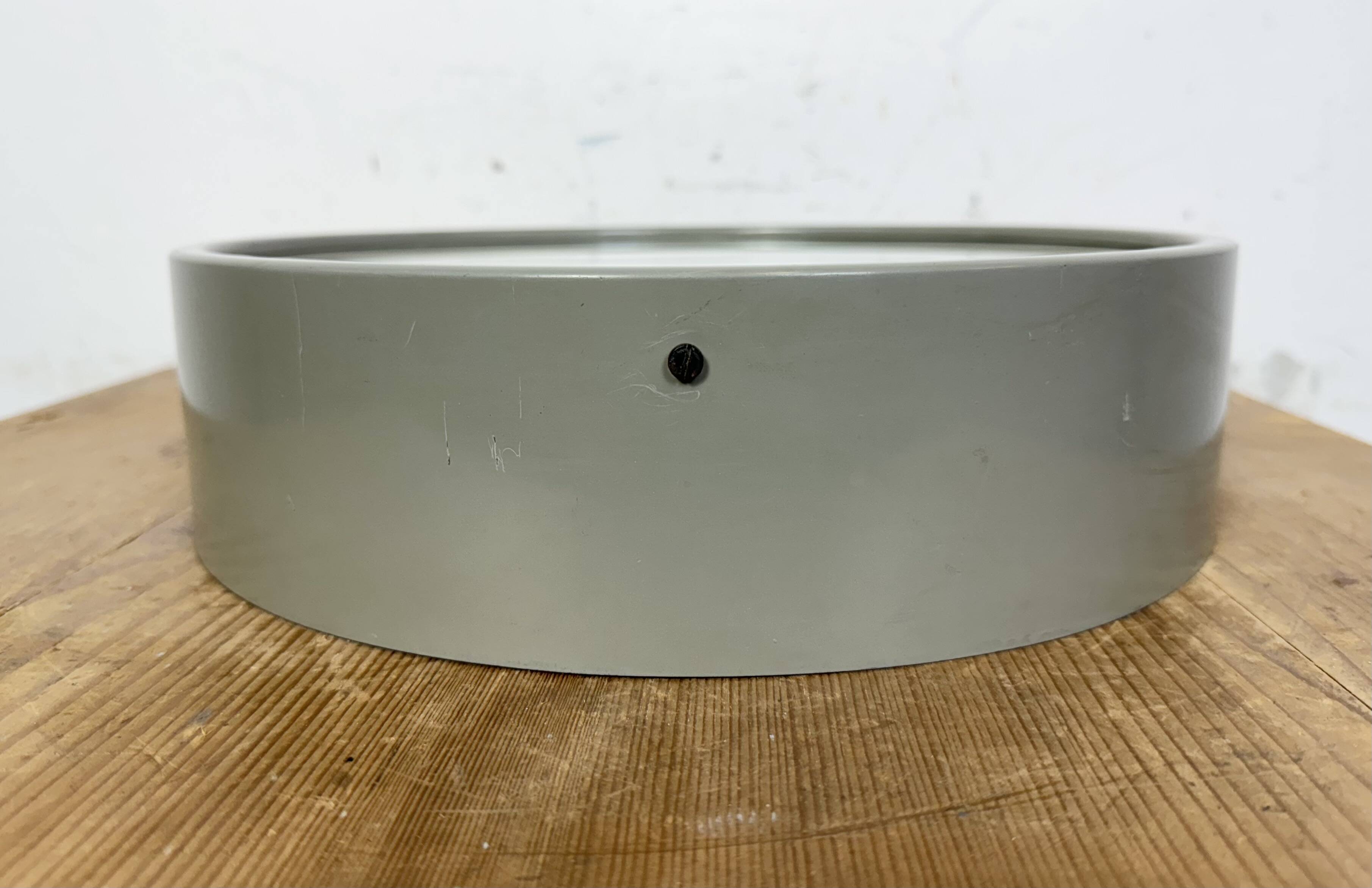 Industrial grey factory wall clock from pragotron, 1960s