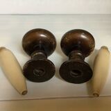 Pair of wooden candlesticks with fake wooden candles.