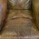 Green antique English cowhide leather armchair on wheels