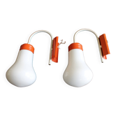 Old pair of orange design wall lights 70s vintage bulb shape