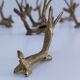 eight vintage brass Gazelle knife rests