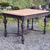 Table from the late 19th century, neo-Renaissance style, in black and oak.