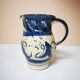 Enamelled ceramic blue pitcher signed by the artist