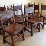 Set of 8 walnut and leather chairs from the 1950s