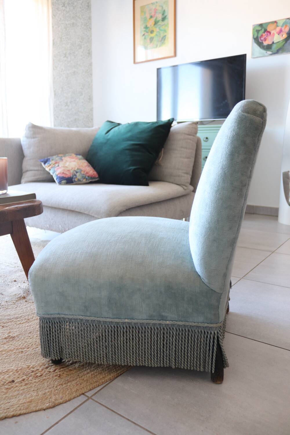 Vintage blue velvet fringed armchair.