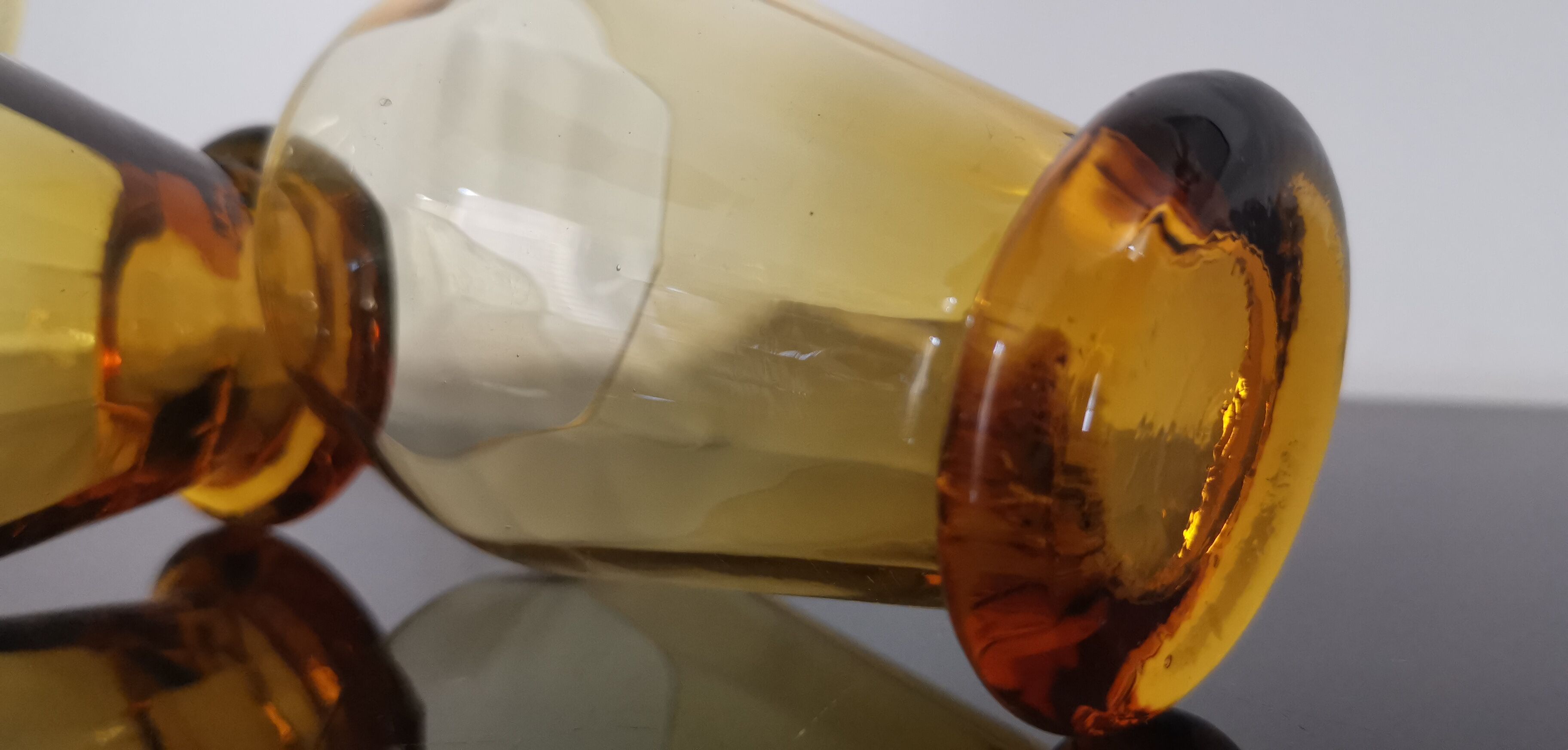 4 old amber colored glasses