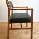 Chair in light teak and black skaï from the 1960s