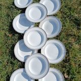 Twelve white porcelain plates