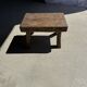 Small stool, rectangular solid teak side table with curved legs.