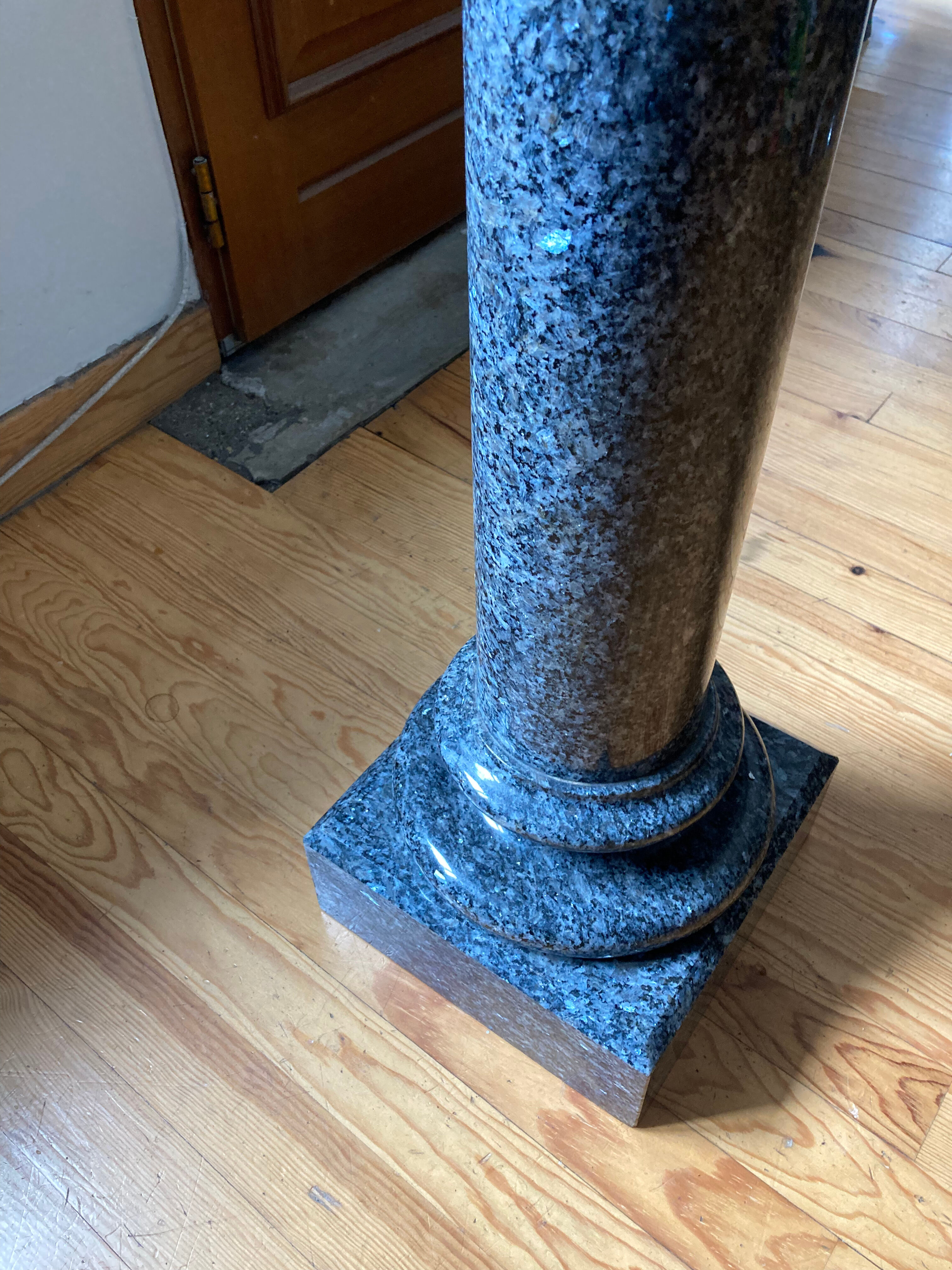 Granite column with pearly reflections