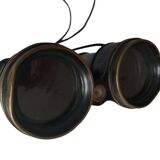 Old brass binoculars with integrated compass