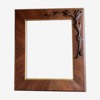 Wooden frame with plating and applied bay leaves