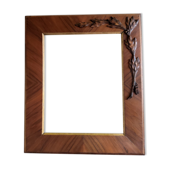 Wooden frame with plating and applied bay leaves