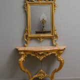 Important console table with a curved shape + Louis XV style mirror in gilded and silvered wood.