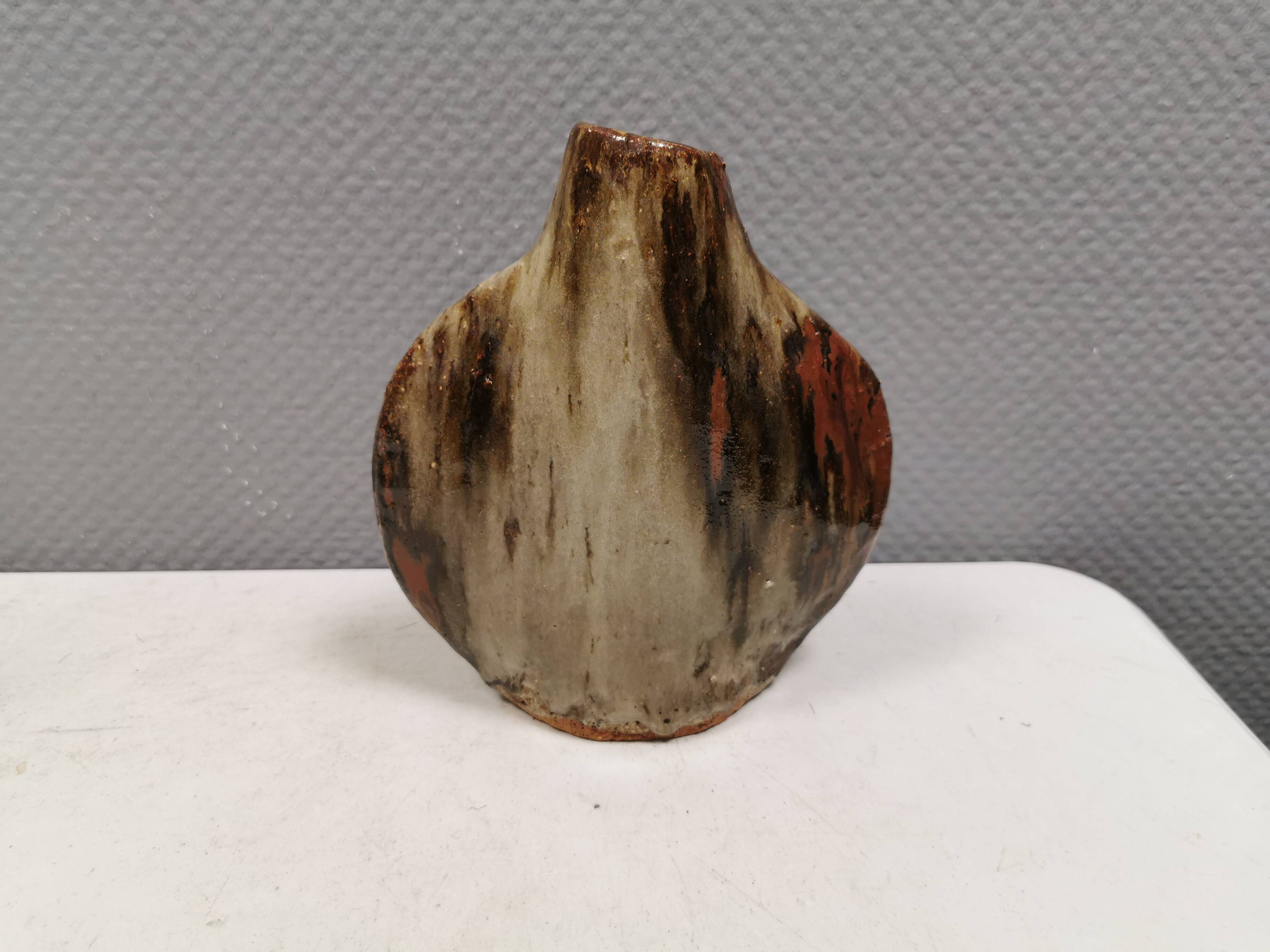 A beautiful Brutalist vase in lovely earth tones. Danish, from the 1980s.