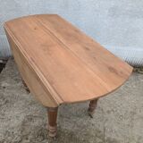 Round table with folding sides