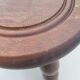 Small vintage tripod stool made of turned wood, in the style of Charles.
