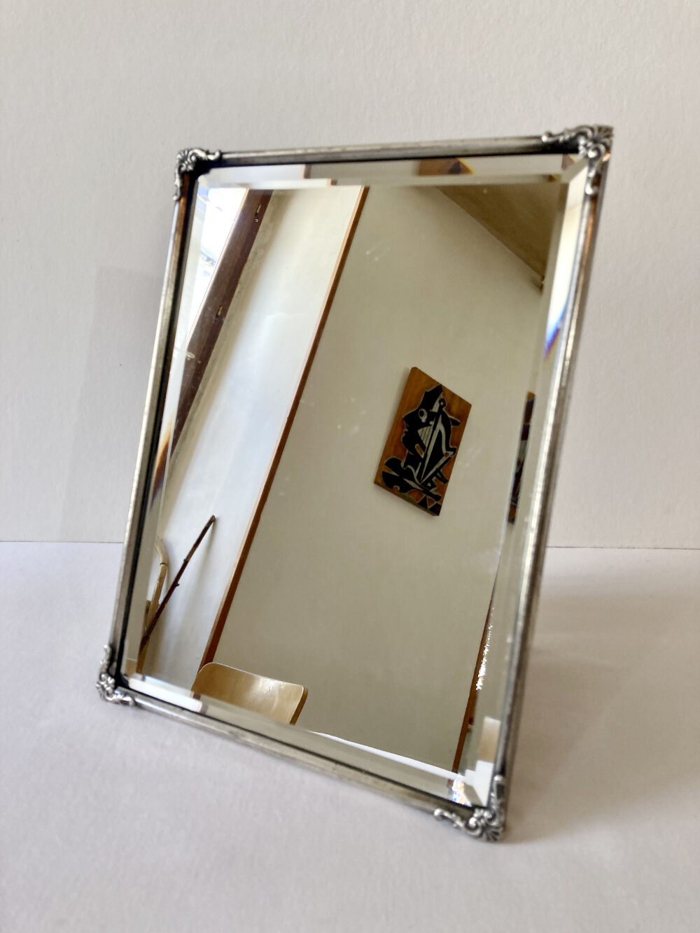 Antique framed mirror, bevelled glass and silver-plated metal frame, 1930-1940.