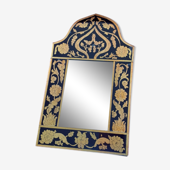 Mirror with black and gold screen printed glass surround.