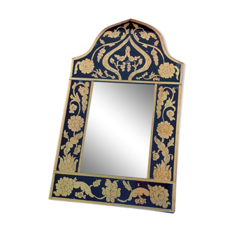 Mirror with black and gold screen printed glass surround.
