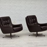 1970s, set of two swivel lounge chairs with footstool, leather.