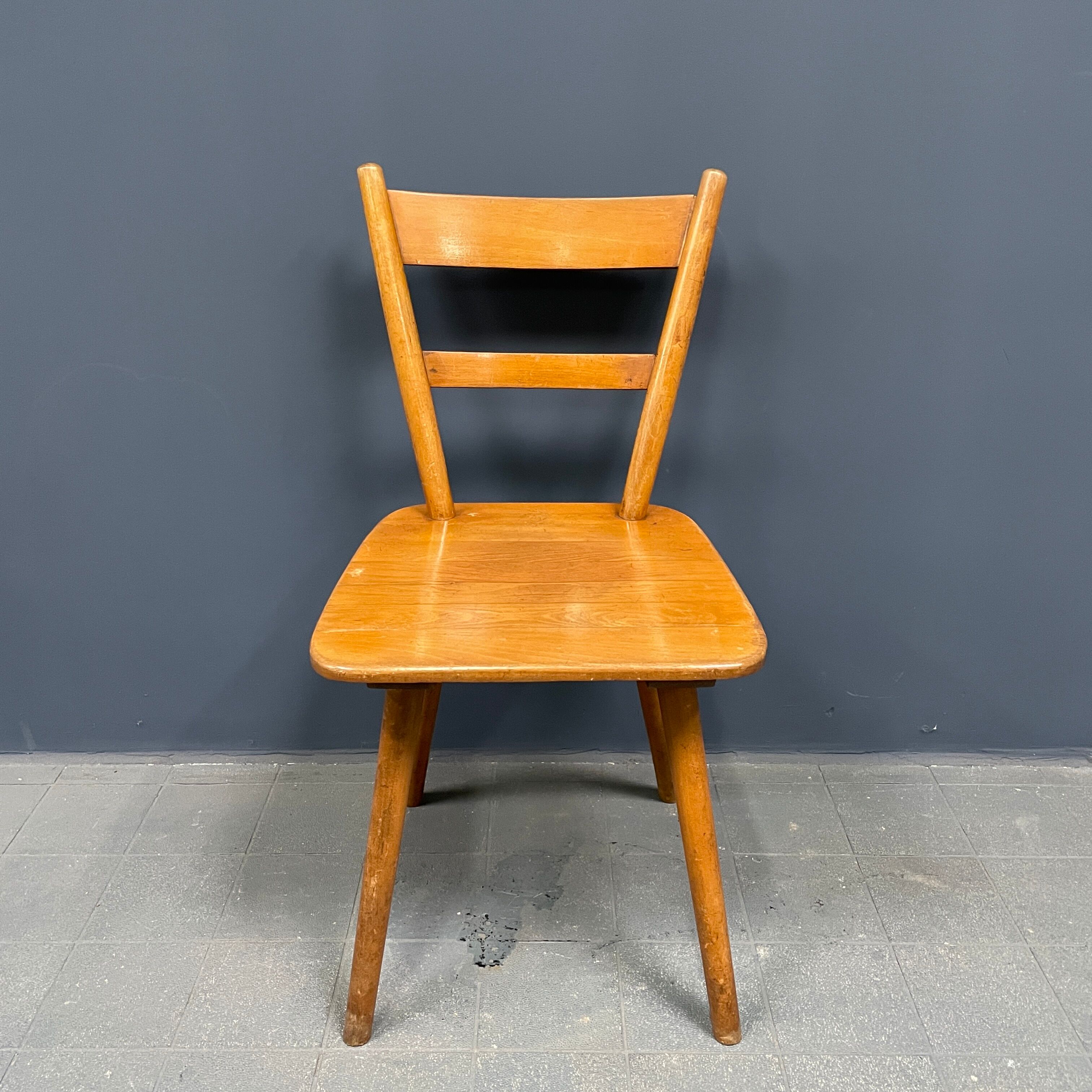 Set of eight german stick chairs from the 1950