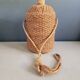 Antique amber glass bottle and hemp carrying bag