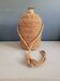 Antique amber glass bottle and hemp carrying bag