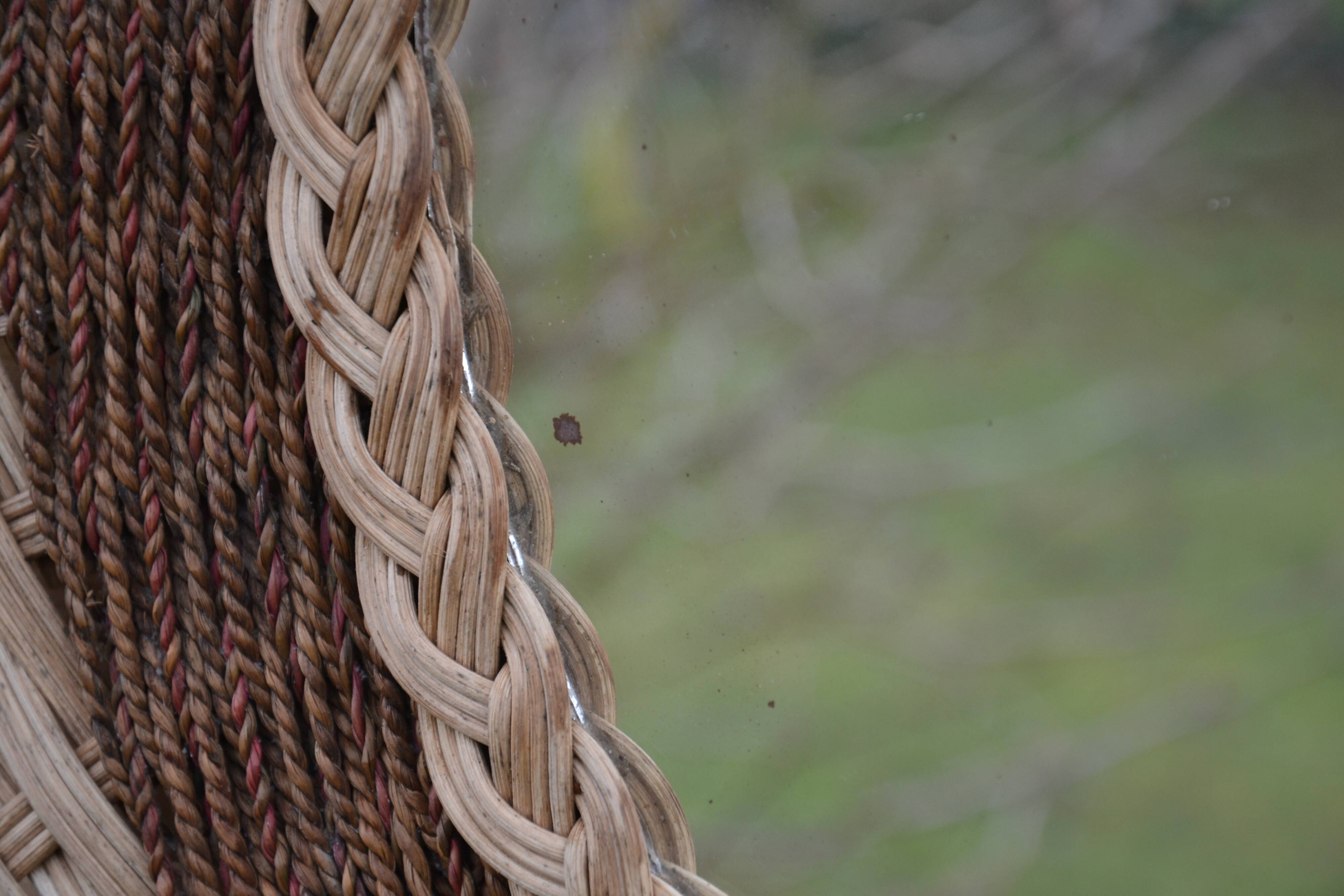 Round woven rattan mirror with rope from the 1970s.