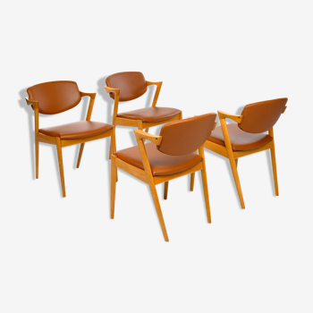 Four Kai Kristiansen oak chairs with new leather upholstery